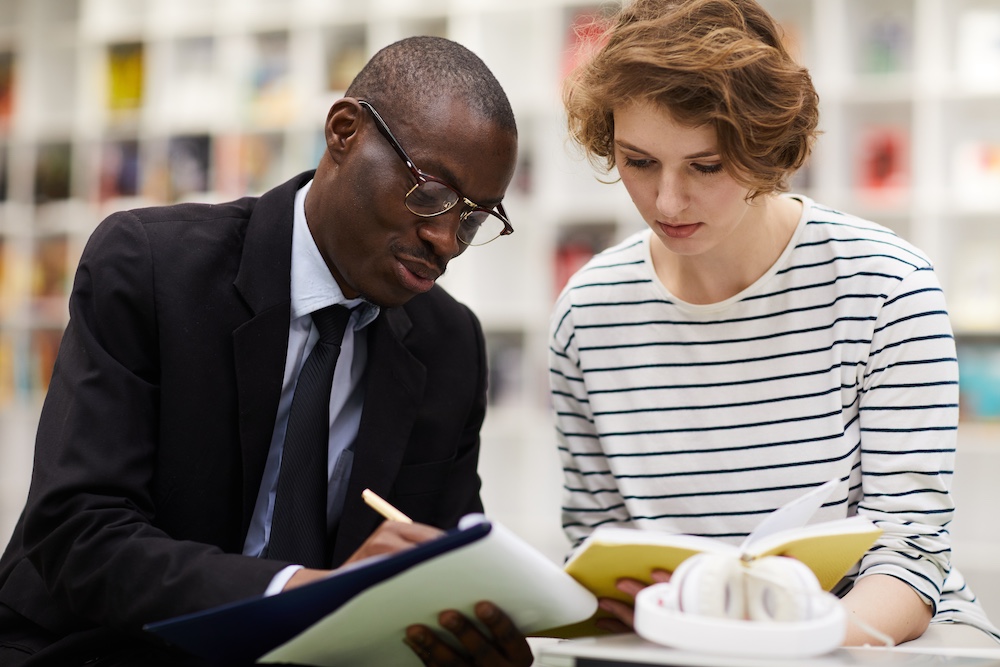 College consultant assisting student girl