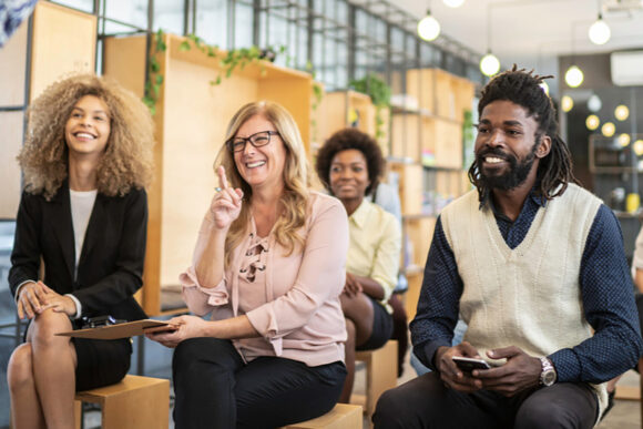 business casual adults in chairs